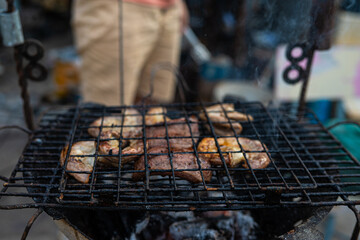 Meat pork grilled on fire outdoor camping party