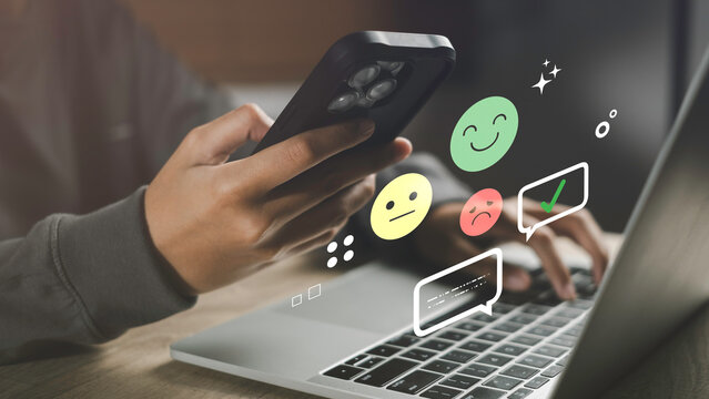 Sentiment analysis and opinion mining concept with emoji faces and digital feedback icons on a laptop and smartphone, representing customer emotions, online review analysis, User experience insights.