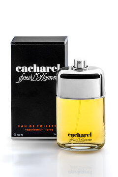 Italy - September 14, 2025: Cacharel eau de toilette pour Homme (for men) in spray bottle near packaging. Cacharel is French clothing and perfume brand founded in 1962 by Jean Bousquet.