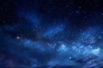 Fototapeta premium Night sky filled with stars and constellations some clouds are visible at the bottom