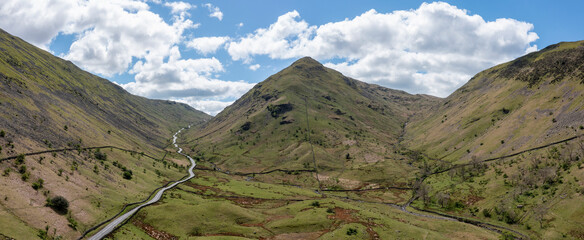 aerial panorama of the kirkstone pass lake district cumbria uk looking south up the pass towards the summit with dod hill centre and idle hill on the right sunny spring day