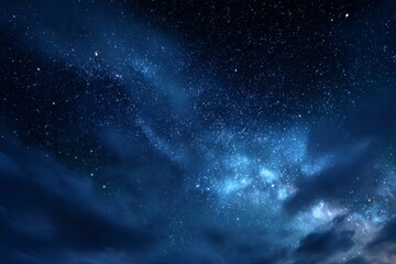 Obraz premium Stars in a dark blue night sky scattered across space with faint clouds