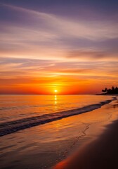 Vibrant sunset hues paint the tranquil beach scene, showcasing the golden light reflecting on the calm ocean waves.