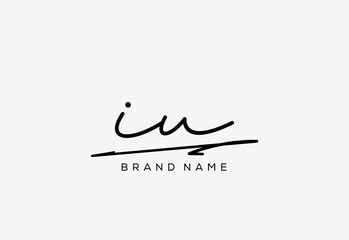 Fototapeta premium IU letter elegant cursive beauty handwriting logo.