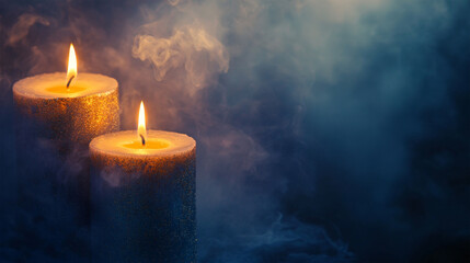 Burning candles with smoke in dark moody background
