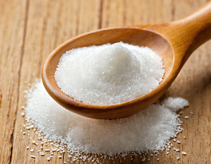 White erythritol sugar substitute in wooden spoon. Natural sweetener for diet, low-calorie food. Healthy alternative to sugar. Keto product for diabetes