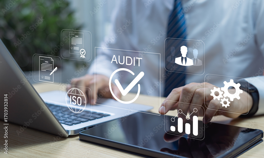 Poster corporate audit and financial review concept showing businessman analyzing data and reports on lapto