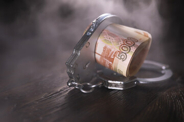 Handcuffs behind, five thousand rubles. Concept of corruption