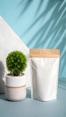 A white stand up pouch and a small green potted plant stand on a blue surface with palm shadows, creating a clean product display.