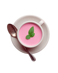 Pink dessert soup in white cup, spoon, saucer