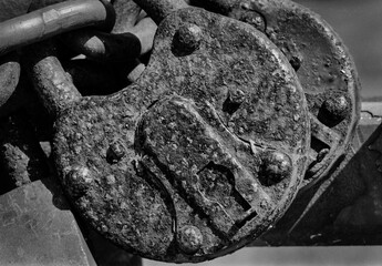 Old, rusty padlock captured on a B&W film. Vintage style.