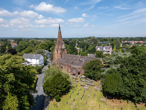 Aerail view of St Mary&rsquo;s Church and graveyard in the village of Eastham, Wirral,  England