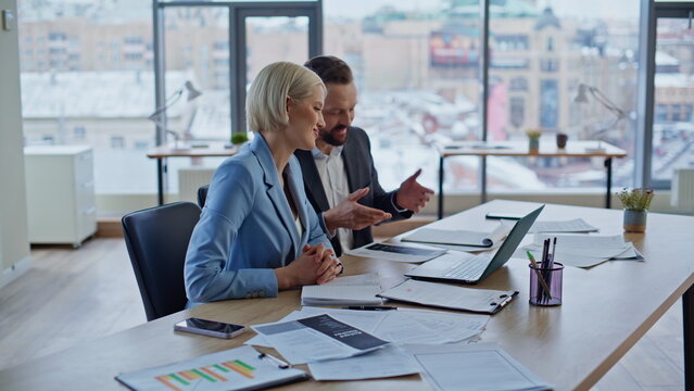 Startupers laughing virtual meeting talking laptop computer in cabinet closeup - Powered by Adobe