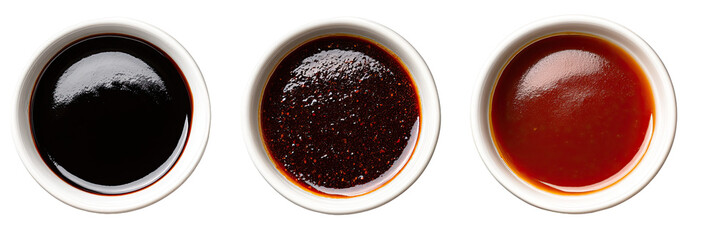 Three small white bowls filled with different sauces