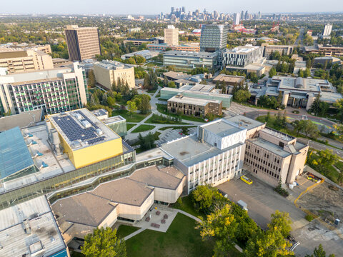 Aerial view of the University of Calgary campus with the city skyline in the distance. 