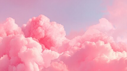 Fototapeta premium Soft, fluffy clouds in shades of pink dominate the sky at sunset, creating a serene atmosphere as the light begins to fade in the early evening.