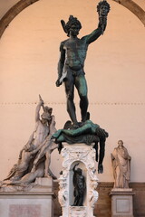 Benvenuto Cellini's Perseus, original bronze work in the Loggia dei Lanzi showing the hero holding the decapitated Medusa's head. Florence-Tuscany-308