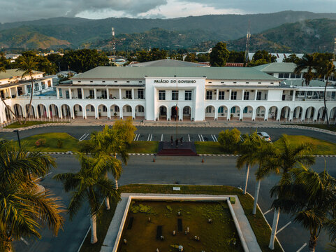 Aerial view of the grand Pal&Atilde;&iexcl;cio do Governo stands majestically against the backdrop of rolling hills, its white facade gleaming under the soft light, Dili, D&Atilde;&shy;li, Timor-Leste.