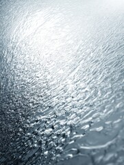 Water Droplets Create Intricate Patterns on a Reflective Surface With Soft Lighting at a Close up Angle During a Calm Moment in Nature