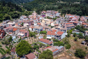 Fototapeta premium Buildings in Benitses town on the Ionian Sea shore on Corfu Island, Greece