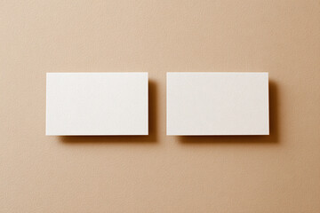 A high quality photography of blank business card or shop card for mock-up and presentation. beige background.
