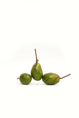 Three small, oval-shaped green ambarella fruits (kedondong) with their stems attached, arranged on a white background. The fruit has a mottled, textured skin.