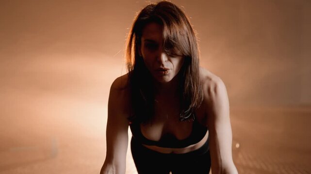 A committed individual tackles a challenging pushup routine, demonstrating strength and focus. The ambient light enhances the inspiring workout, motivating them to reach new heights in fitness