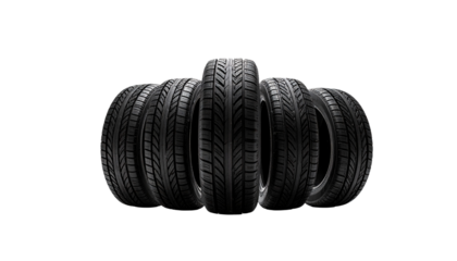 A set of five brand new tires in a row. These tires are ready to be mounted on a vehicle 