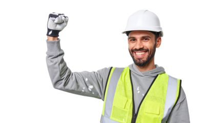 A construction worker celebrates a successful project, filled with pride and accomplishment, with a clenched fist raised in the air