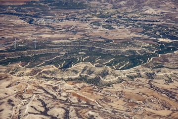 Aerial view from plane window with Moglia Wind Farm in Cyprus island country