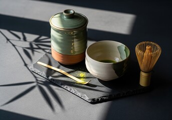 Japanese matcha tea ceremony set with traditional tools and shadow
