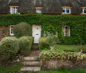 Traditional English village with thatched cottages.