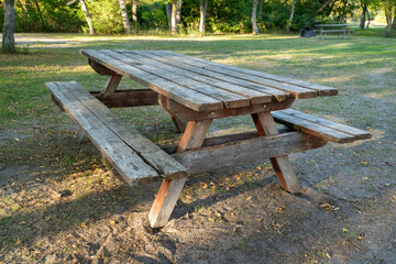 weathered wooden picnic table in Whitetail Campground in Nebraska National Forest near Halsey