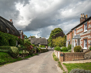 Traditional English village with thatched cottages.