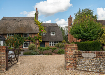 Traditional English village with thatched cottages.