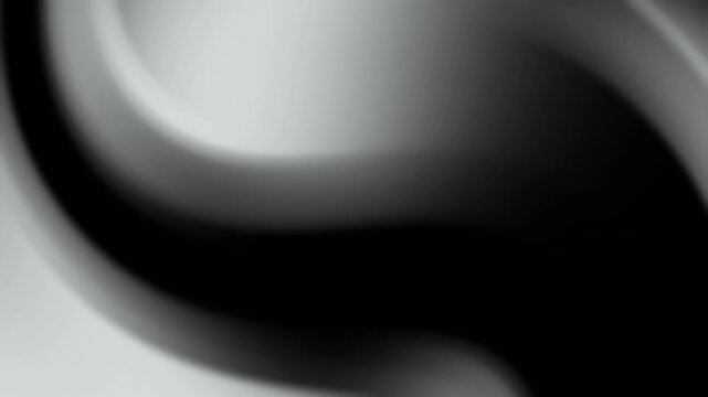This is an abstract animated background featuring black and grey gradient tones with flowing, wave-like curves. The smooth transitions and soft shapes create a modern and elegant atmosphere. 