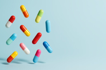 Colorful Capsules in Mid-Air: A vibrant array of colorful capsules appears to float mid-air, against a light blue backdrop, offering a striking visual representation of medication, health.
