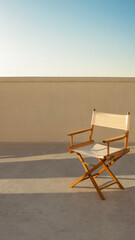 A director's chair on a rooftop with a cityscape in the background