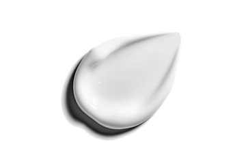 A smooth, glossy, white cosmetic cream, shaped like a teardrop or almond, isolated against black