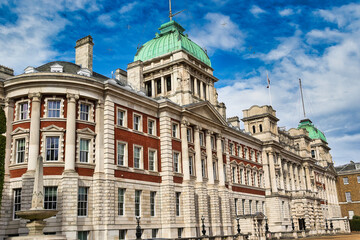 Classical Building with Red Brick, Stone Facade, and Green Domes  in London, UK.