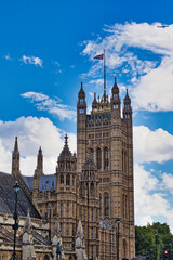 Palace of Westminster with Union Jack  in London, UK.