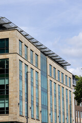 Beige Stone Building with Glass Windows and Solar Panels  in Newcastle upon Tyne, UK.