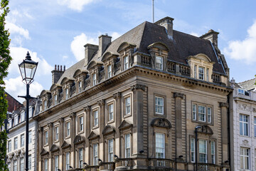 Fototapeta premium Stone Building with Dormer Windows and Lamppost in Newcastle upon Tyne, UK.