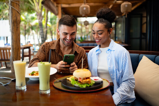 A diverse couple creates social proof as content drives reviews, bookings, loyalty and growth