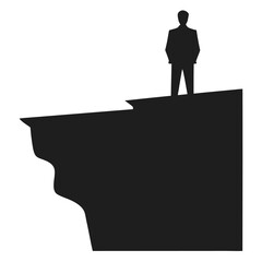 Silhouette of a man stands alone on a jagged cliff overlooking the horizon with transparency