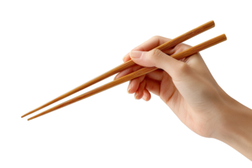 Hand holding wooden chopsticks