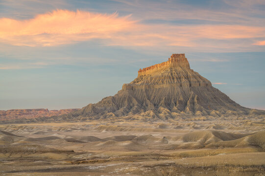 Factory Butte in the Upper Blue Hills at sunset, Wayne County, Utah, USA