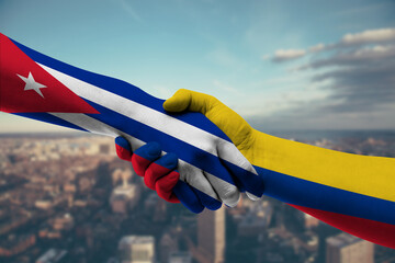 Shaking hands Cuba and Colombia