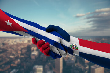 Shaking hands Cuba and Dominican Republic