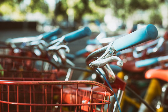 Close-up of the handlebars and baskets on a row of bicycles parked side by side, Silicon Valley, California, USA